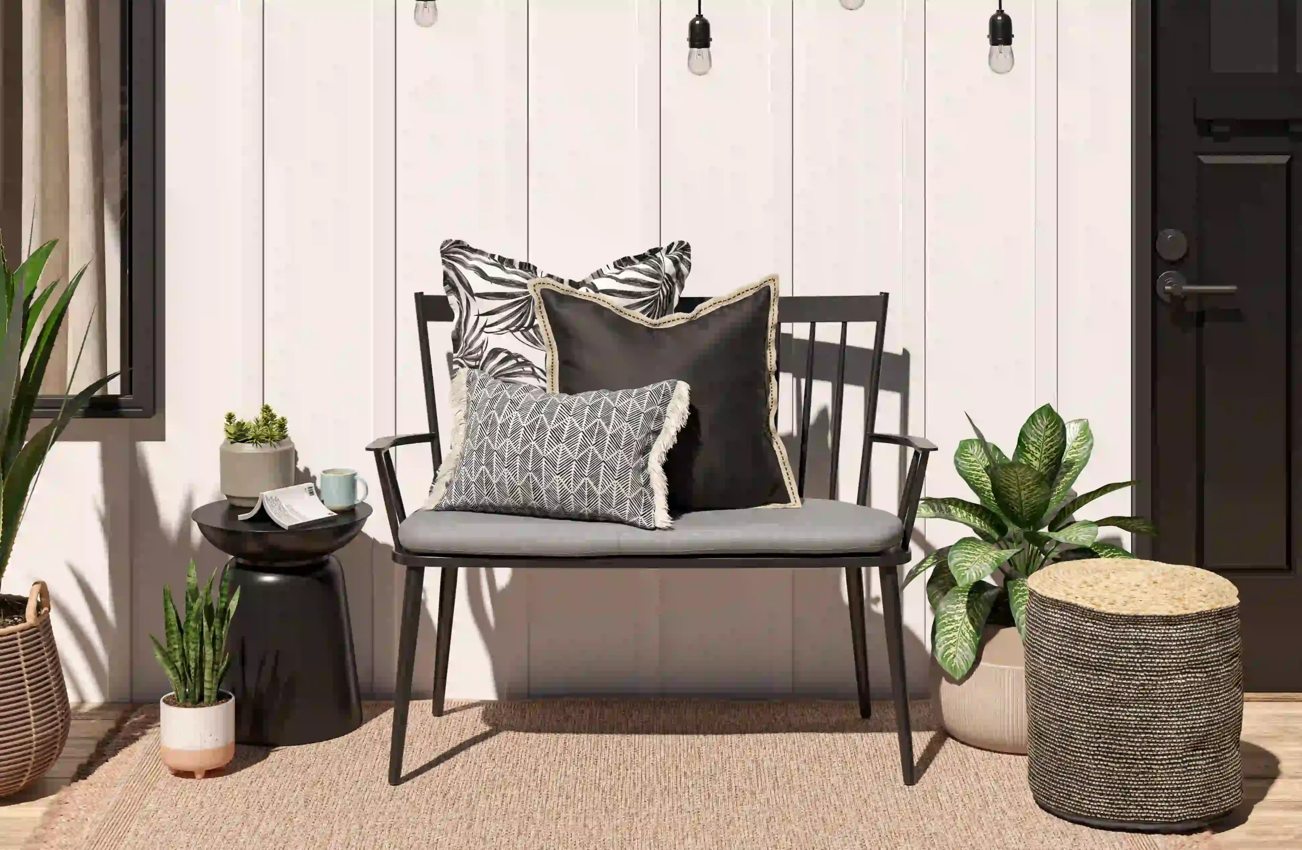 Black steel garden bench with monochrome pillows and eclectic planters in a bright outdoor vignette, CGI render